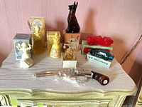 Group shot of eight Avon perfume decanters on dresser