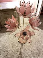 Full view of pink lotus lamp with five flower heads, brass base visible