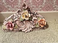 Front view showing entire Capodimonte mantle sculpture with three roses