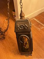 Lantern full view showing chain and finial