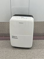 Front view of Garrison dehumidifier showing logo and overall condition