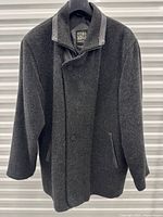 Full front view of charcoal grey coat on hanger