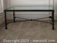 Assembled glass-top metal coffee table sample