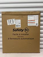 Front view of Safety 1st gate box showing branding and condition