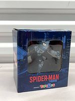 Front of boxed Spider-Man figurine showing window and Toys“R”Us logo