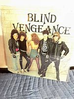Front cover of sealed Blind Vengeance Taste of Sin LP showing band photo and title