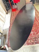 Full view of black oval tabletop