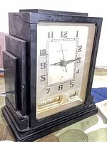 Front angled view of Bakelite clock showing stepped case design and dial