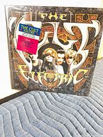 Front cover showing album art, sealed in shrink