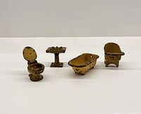 All four visible miniature painted metal bathroom pieces grouped