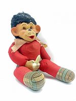 Three-quarter view of vintage stuffed monkey doll showing overall appearance
