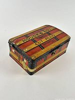 Three-quarter view highlighting hinged lid and trunk design