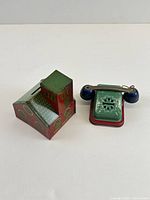 Both lithographed tin banks side by side