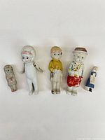 Front view of all five porcelain figures