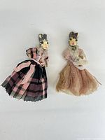 Front view of both rabbit dolls in dresses