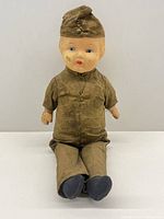 Front view of Ideal composition boy soldier doll in khaki uniform