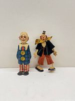 Both clown figures side by side for scale and comparison