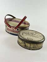 Both oval tins side by side showing relative size and design