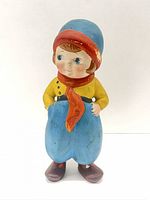 Front view of ceramic Dutch boy figurine