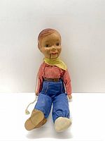 Front view of 21-inch Howdy Doody pull-cord doll seated