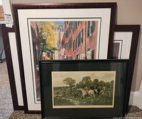 Front view of three stacked framed prints