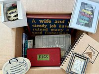 Box containing tackle boxes, books, framed print, plaques, ornament