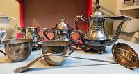 Front view of entire tea/coffee set with ladle