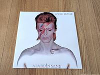 Front cover with lightning-bolt portrait