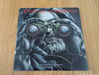 Front cover showing binocular-clad figure artwork