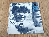 Front cover showing childhood photo artwork and title