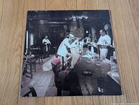 Front jacket showing bar scene artwork