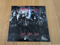 Front album cover with band photo and title