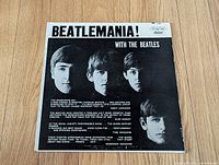 Front cover showing album title and Beatles portraits