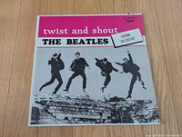 Front sleeve showing title banner and band photo