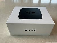 Front corner perspective of sealed Apple TV 4K box