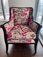 Full front view of armchair showing frame and upholstery