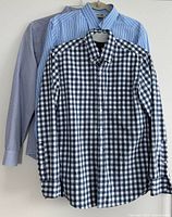 Three shirts on hangers showing patterns and colors