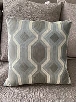 Front view of pillow showing full geometric pattern