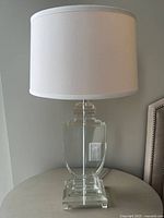 Full view of lucite lamp with shade