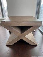 Front view showing full X-base design and square top