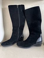 Full view of both boots standing side by side