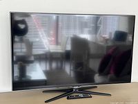 Front view of Samsung 50-inch TV on pedestal stand