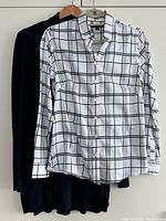 Both garments on hangers