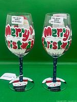 Front view showing Merry Christmas text design on both glasses