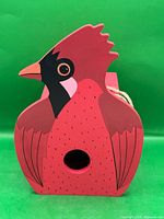 Front view showing cardinal silhouette and entry hole