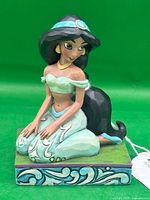 Front view of Jasmine figurine on decorative base