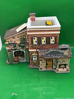 Front three-quarter view of Grapevine Winery illuminated building