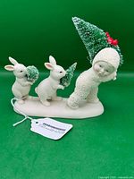 Full view of Snowbabies figurine with two rabbits and trees