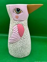 Front left view of ceramic bird watering can/vase