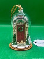 Front view of ornament showing full scene under dome